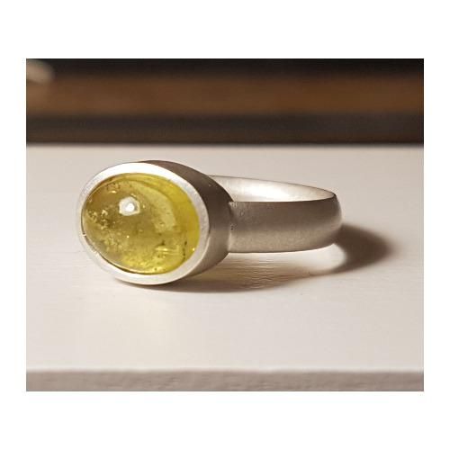 Silver ring with yellowish green tourmaline