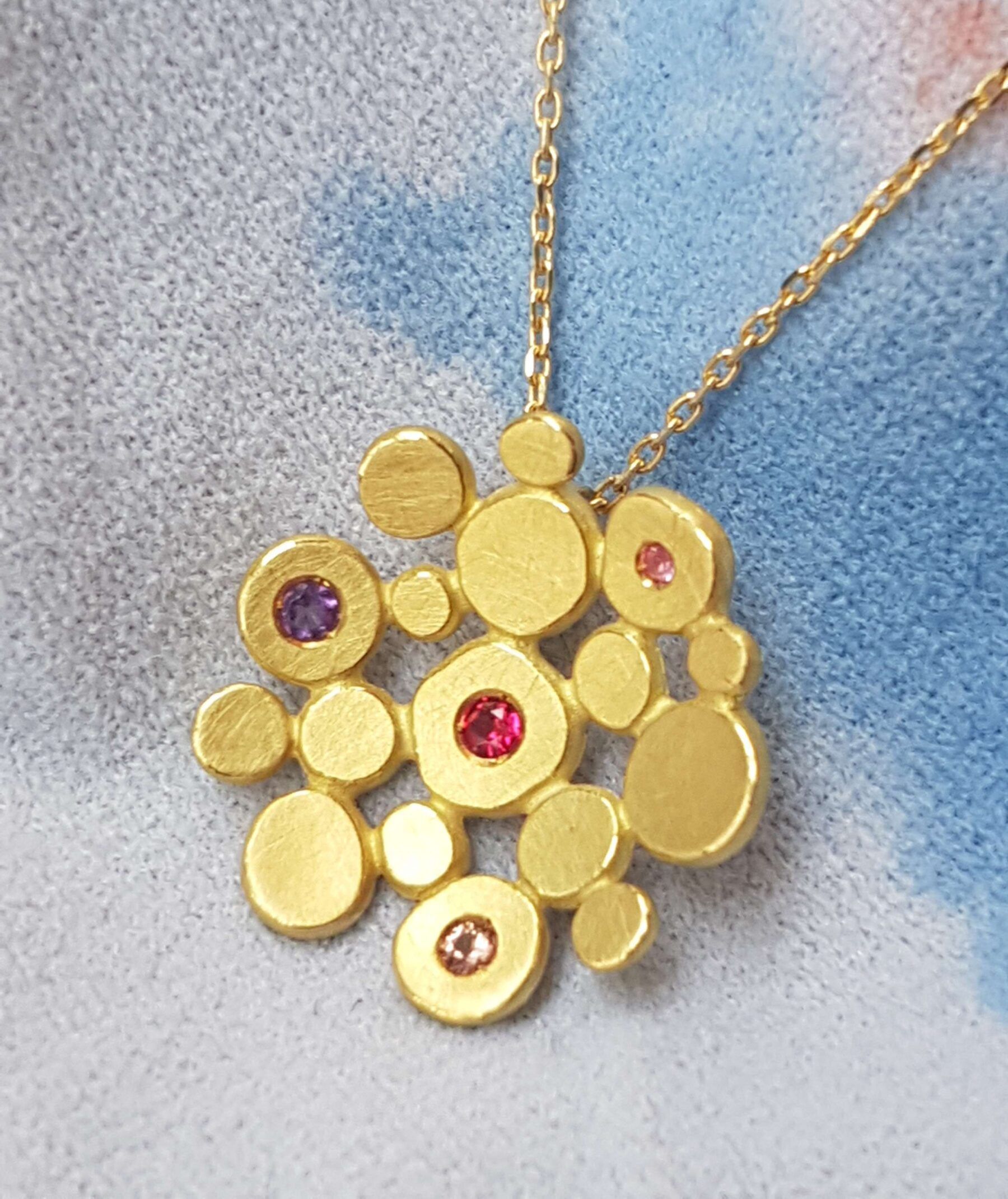 Gold pendant made from 18ct Fairmined gold with ethically sourced gemstones