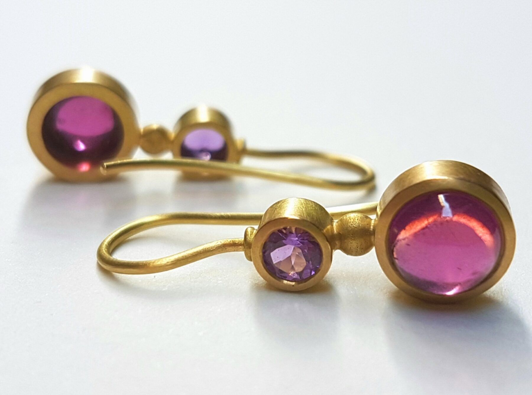 18 carat gold earrings with rodolite garnet and amethyst, one of a kind
